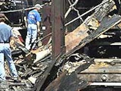 Owner Steve Mothon, left, surveys the wreckage at Pro Circuit Auto Sports Owner Steve Mothon, left, surveys the wreckage at Pro Circuit Auto Sports