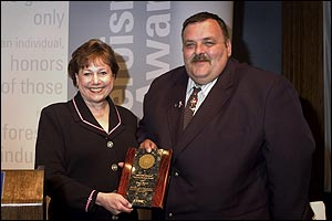 Secretary Ann Veneman, U.S. Department of Agriculture, presents award to Mark S. Warnick.