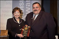 Secretary Ann Veneman, U.S. Department of Agriculture, presents award to Mark S. Warnick. Secretary Ann Veneman, U.S. Department of Agriculture, presents award to Mark S. Warnick.
