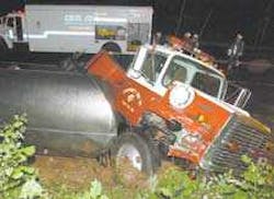 Rising Sun Fire Company water tanker sits where it tipped over Monday after a collision at the intersection of Liberty Grove Road and Jacob Tome Highway near Rising Sun