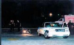 Police examine the windshield damage of a Pasadena deputy fire marshal's take-home vehicle Saturday after it collided with a motorcycle driver who died soon after being taken to the hospital by Life Flight. Police examine the windshield damage of a Pasadena deputy fire marshal's take-home vehicle Saturday after it collided with a motorcycle driver who died soon after being taken to the hospital by Life Flight.