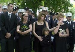At the memorial service for Firefighter Chris Trumpf, held at the Presbyterian Church in Morristown Tuesday, from left, son Bill, daughter Tracy, daughter April Tribus and granddaughter Chelsea Tribus, and wife Debbie watch as Trumpf's casket is driven away after the service. At the memorial service for Firefighter Chris Trumpf, held at the Presbyterian Church in Morristown Tuesday, from left, son Bill, daughter Tracy, daughter April Tribus and granddaughter Chelsea Tribus, and wife Debbie watch as Trumpf's casket is driven away after the service.