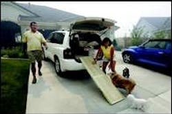 An unidentified couple load their pets for evacuation from Waterford Place An unidentified couple load their pets for evacuation from Waterford Place