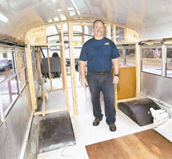 Captain Steve Smith (below) stands inside the unfinished interior.