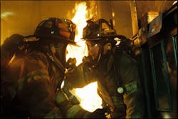 Actors Robert Patrick (right) and Joaquin Phoenix in the blazing action during a scene in Ladder 49.