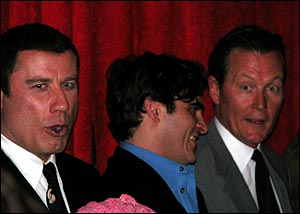 John Travolta, Joaquin Phoenix and Robert Patrick enjoy a moment at the reception.