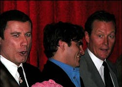 John Travolta, Joaquin Phoenix and Robert Patrick enjoy a moment at the reception.