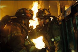 Patrick and Phoenix during an intense, smokey apartment blaze scene.