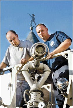 Bert Ashber (left), a deputy chief with the Leatherwood Fire and Rescue Company of eastern Kentucky, inspects the nozzle of Tower 2, a bucket truck donated to his company Monday by the Rouss Volunteer Fire and Rescue Company in Winchester. Joining Ashber for one last look at the 25-year-old vehicle is Rouss Deputy Chief Cliff Montgomery. Bert Ashber (left), a deputy chief with the Leatherwood Fire and Rescue Company of eastern Kentucky, inspects the nozzle of Tower 2, a bucket truck donated to his company Monday by the Rouss Volunteer Fire and Rescue Company in Winchester. Joining Ashber for one last look at the 25-year-old vehicle is Rouss Deputy Chief Cliff Montgomery.