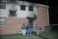In the photo (from left to right): Captain Craig Haney and Senior Firefighter Henry McElvain with the Chattanooga Fire Investigation Division, and Sergeant Craig Johnson with the Chattanooga Police Department's Crime Scene Unit examine the second story window the father and two children reportedly used to escape the flames. In the photo (from left to right): Captain Craig Haney and Senior Firefighter Henry McElvain with the Chattanooga Fire Investigation Division, and Sergeant Craig Johnson with the Chattanooga Police Department's Crime Scene Unit examine the second story window the father and two children reportedly used to escape the flames.