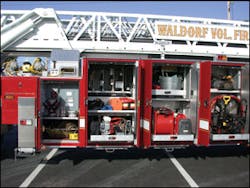The Waldorf, MD, Fire Department’s Truck 3 carries a wide assortment of fans and power equipment on slide trays. Note the location of the electric cable reel and portable lights at the front portion of the body. The rig also carries five tool boxes for a variety of applications. The Waldorf, MD, Fire Department’s Truck 3 carries a wide assortment of fans and power equipment on slide trays. Note the location of the electric cable reel and portable lights at the front portion of the body. The rig also carries five tool boxes for a variety of applications.