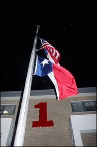 Flags fly half-staff Monday at the BFD's Station 1 on Garth Road in honor of Nito Guajardo, who was killed in a house fire on Burning Tree Drive.