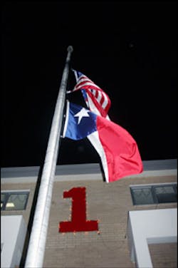 Flags fly half-staff Monday at the BFD&apos;s Station 1 on Garth Road in honor of Nito Guajardo, who was killed in a house fire on Burning Tree Drive.