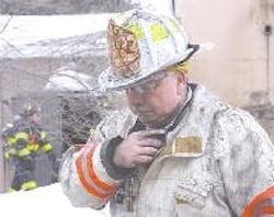Deputy Leominster Fire Chief Ronald Pierce speaks on his radio as fire crews extinguish a fire at Modern Dispersions Inc. Deputy Leominster Fire Chief Ronald Pierce speaks on his radio as fire crews extinguish a fire at Modern Dispersions Inc.