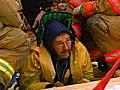 Rescuers Work Carefully To Save Man
