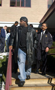Volunteer Captain Joe Johnson and Acting Fire Chief Lawrence Sedgwick, Jr. leave the rehabilitation hospital Wednesday after speaking with reporters. Johnson told reporters, 'I intend to return to duty as a firefighter.'