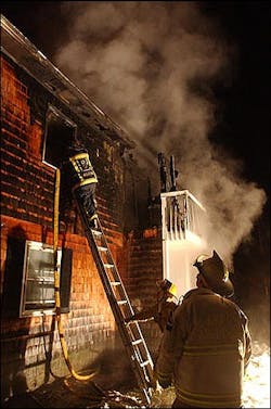 Firefighters work on a fire at an apartment building in Berlin, Vt., Thursday, Feb. 3, 2005.