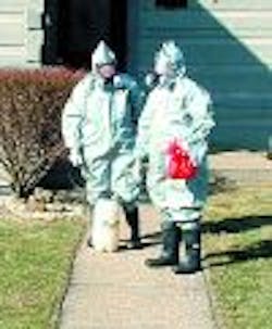 Firefighters Julie Roper and John Dowdell recover a suspicious substance from a residence in southern Brown County. Firefighters Julie Roper and John Dowdell recover a suspicious substance from a residence in southern Brown County.