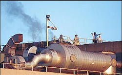 Members of the Jonesboro Fire Department and plant employees stand on the roof of the building while firefighters attempt to make their way to a fire inside the Post Cereal-Kraft Foods plant late Monday, Feb. 14, 2005, in Jonesboro, Ark. Firefighters said the blaze was contained to a single boiler room on the third floor of the structure. Members of the Jonesboro Fire Department and plant employees stand on the roof of the building while firefighters attempt to make their way to a fire inside the Post Cereal-Kraft Foods plant late Monday, Feb. 14, 2005, in Jonesboro, Ark. Firefighters said the blaze was contained to a single boiler room on the third floor of the structure.