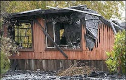 The scene of the house fire in Los Gatos, Calif., Monday, Feb. 14, 2005, where Santa Clara County Fire Department Capt. Mark McCormack died early Sunday.