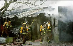 Firefighters tend to the smoldering remains of Judge Roy Bean's, a longtime Eastern Shore landmark pub, Tuesday, Feb. 15, 2005, in Daphne, Ala. The establishment on Scenic Highway 98 had operated since 1946, with singers Jimmy Buffett, Jerry Jeff Walker and Emmy Lou Harris among those performing at the old wooden building with a big fenced-in back yard. Firefighters tend to the smoldering remains of Judge Roy Bean's, a longtime Eastern Shore landmark pub, Tuesday, Feb. 15, 2005, in Daphne, Ala. The establishment on Scenic Highway 98 had operated since 1946, with singers Jimmy Buffett, Jerry Jeff Walker and Emmy Lou Harris among those performing at the old wooden building with a big fenced-in back yard.