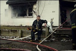 Mike Cook, an Kokomo firefighter, takes a few minutes after searching for people trapped in a burning home in Kokomo, Ind., Sunday morning, Feb. 20, 2005. A woman died along with three of her children. Mike Cook, an Kokomo firefighter, takes a few minutes after searching for people trapped in a burning home in Kokomo, Ind., Sunday morning, Feb. 20, 2005. A woman died along with three of her children.