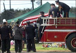 San Antonio Professional Firefighters Local 624 Honor Guard remove the flag draped coffin of Air Force Staff Sgt. Ray Rangel at San Fernando Cemetery No. 3 Monday, Feb. 21, 2005, in San Antonio. Rangel died on February 13 in Iraq while trying to rescue soldiers from a Humvee that rolled into a canal near Balad, Iraq. San Antonio Professional Firefighters Local 624 Honor Guard remove the flag draped coffin of Air Force Staff Sgt. Ray Rangel at San Fernando Cemetery No. 3 Monday, Feb. 21, 2005, in San Antonio. Rangel died on February 13 in Iraq while trying to rescue soldiers from a Humvee that rolled into a canal near Balad, Iraq.