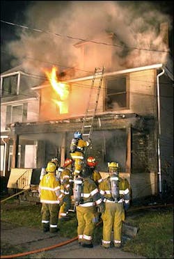 Flames shoot out of the second floor of a single-family home in Tarentum, Pa., early Tuesday, Feb 22, 2005, as firefighters work to contain the fire. Two adults and a teenager were killed in the blaze, fire officials said. Flames shoot out of the second floor of a single-family home in Tarentum, Pa., early Tuesday, Feb 22, 2005, as firefighters work to contain the fire. Two adults and a teenager were killed in the blaze, fire officials said.