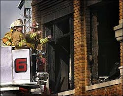 Anderson Township firefighters and an Indiana state fire marshall investigator look over the scene of fatal fire that killed three children and seriouly injured five others, Wednesday, Feb. 23, 2005, in Milroy Ind. Anderson Township firefighters and an Indiana state fire marshall investigator look over the scene of fatal fire that killed three children and seriouly injured five others, Wednesday, Feb. 23, 2005, in Milroy Ind.