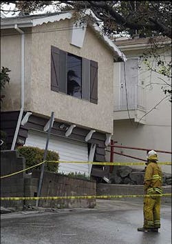 A Los Angeles County firefighter checks the damages to a home red tagged because of unstable ground due to heavy rains in the Glassell Park area of Los Angeles, Wednesday, Feb. 23, 2005. A Los Angeles County firefighter checks the damages to a home red tagged because of unstable ground due to heavy rains in the Glassell Park area of Los Angeles, Wednesday, Feb. 23, 2005.