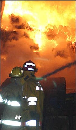 Firefighters battle a blaze at Midwest Padding factory in Norfolk, Neb., Wednesday, March 2, 2005.