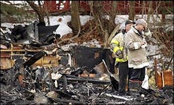 A firefighter holds his hand to his forehead as he stands amidst the rubble at the scene of a deadly fire at The Station nightclub in West Warwick, R.I. in this Feb. 21, 2003 file photo. After a two-year investigation into what caused a West Warwick nightclub to become a deadly firetrap, a panel of experts on Thursday planned to release recommendations to keep a similar tragedy from happening again. A firefighter holds his hand to his forehead as he stands amidst the rubble at the scene of a deadly fire at The Station nightclub in West Warwick, R.I. in this Feb. 21, 2003 file photo. After a two-year investigation into what caused a West Warwick nightclub to become a deadly firetrap, a panel of experts on Thursday planned to release recommendations to keep a similar tragedy from happening again.