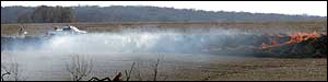 Firefighters battle a grass fire Sunday, March 6, 2005, east of Carson, Iowa. Firefighters remained on guard early Monday after grass fires swept through eastern Pottawattamie County, destroying four homes and scorching more than 4,000 acres.