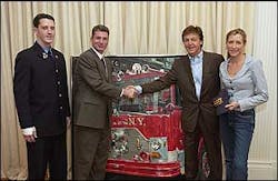 UFA President Steve Cassidy and Firefighter Brendan Cawley of Ladder 27 in the Bronx, who is recovering from a five-story jump that he and fellow firefighters had to make from a fire on Sunday, January 23rd, accepted the painting.