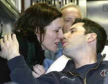 Mary Jo Starks plants a loving kiss on firefighter boyfriend Joseph DiBernardo Jr. yesterday as her intrepid hero is discharged from the hospital.