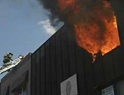INFERNO: Firefighters scramble to contain an apartment fire in Brooklyn yesterday. The fire was started by a tenant's votive candle that pore Jesus' picture. INFERNO: Firefighters scramble to contain an apartment fire in Brooklyn yesterday. The fire was started by a tenant's votive candle that pore Jesus' picture.