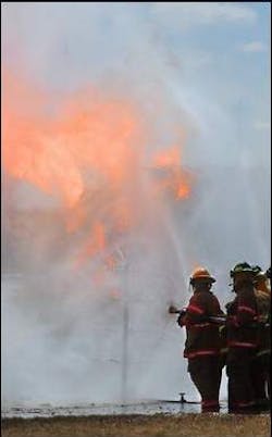Firefighters get experience in the right way to extinguish a fire involving propane gas. Firefighters get experience in the right way to extinguish a fire involving propane gas.