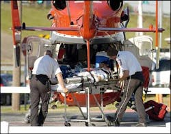 Emergency officials load a BP employee into a life flight helicopter at the Mainland Medical Center to be taken to Memorial Herman Hospital after an explosion at the BP oil refinery plant in Texas City, Texas on Wednesday, March 23, 2005