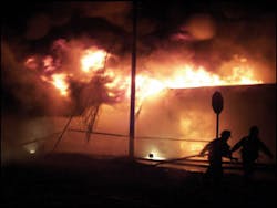 Firefighters relocate from the west side after Battalion Chief Gary Stevens called for a defensive attack. Firefighters relocate from the west side after Battalion Chief Gary Stevens called for a defensive attack.