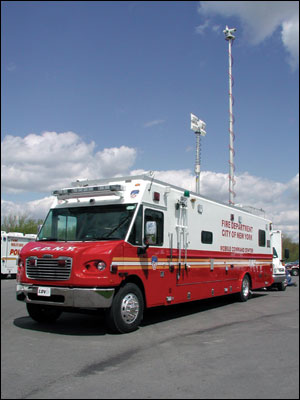 Telescoping masts on the FDNY unit provide a platform for a variety of devices. The communications area is separated from the command/conference area by sliding doors.