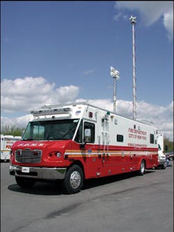 Telescoping masts on the FDNY unit provide a platform for a variety of devices. The communications area is separated from the command/conference area by sliding doors.