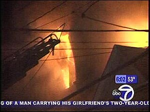 A five-alarm fire burned through a row of homes in Yonkers this morning.