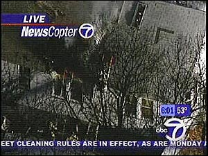 It looks as though, the fire department has just extinguished the last of the flames, at least those that were burning up to the roof.