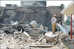 Hope firefighter Todd Martin, right, sprays water on the rubble of the destroyed portion of Hope High School, Sunday, April 17, 2005, in Hope, Ark.(AP Photo/Texarkana Gazette, Jim Williamson) Hope firefighter Todd Martin, right, sprays water on the rubble of the destroyed portion of Hope High School, Sunday, April 17, 2005, in Hope, Ark.(AP Photo/Texarkana Gazette, Jim Williamson)