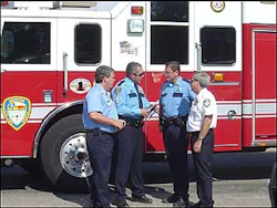 (l to r) Capt. Mike Shrum - HFD, Sgt. David Crain - HPD, Senior Police Officer Pat Siddons - HPD, District Chief Jack Williams -HFD. (l to r) Capt. Mike Shrum - HFD, Sgt. David Crain - HPD, Senior Police Officer Pat Siddons - HPD, District Chief Jack Williams -HFD.
