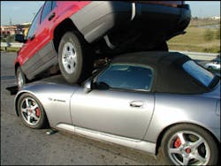 Although not a roof-resting scenario, this car-on-car crash is another example of when alternative access to the battery will be necessary. Anytime the hood cannot be opened, crews should be ready to use any of the three alternative means to shut down the battery. Although not a roof-resting scenario, this car-on-car crash is another example of when alternative access to the battery will be necessary. Anytime the hood cannot be opened, crews should be ready to use any of the three alternative means to shut down the battery.
