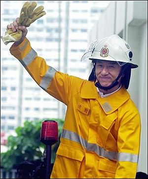 Hong Kong movie star Jackie Chan salutes the crowd Tuesday, May 3, 2005, as he is introduced as the ambassador for Hong Kong's World Firefighter Games. (AP Photo/Lo Sai Hung)