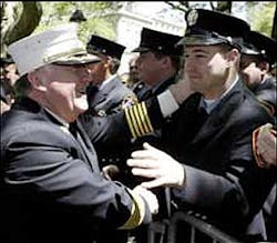 MAKING THEM PROUD: FDNY Chief Peter Hayden (left) greets firefighters after testifying to the council yesterday. MAKING THEM PROUD: FDNY Chief Peter Hayden (left) greets firefighters after testifying to the council yesterday.
