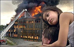 Alexis McClellan, 6, rests on the shoulders of her father, Tad, as they watched the Beich Candy Factory in Bloomington, Ill., burn to the ground Wednesday, May 25, 2005. (AP Photo/The Pantagraph, David Proeber)