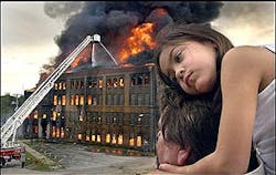 Alexis McClellan, 6, rests on the shoulders of her father, Tad, as they watched the Beich Candy Factory in Bloomington, Ill., burn to the ground Wednesday, May 25, 2005. (AP Photo/The Pantagraph, David Proeber)